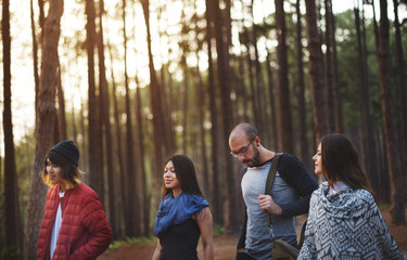 Friends hanging out in a forest
