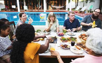 Group of diverse people enjoying barbecue party together