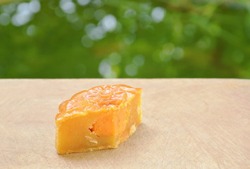 moon cake Chinese tradition dessert stuffed mushed durian slice for piece on chop block