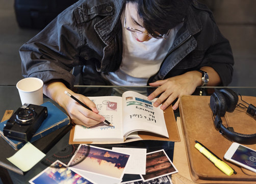 Asian Guy Making Notes Diary Notebook