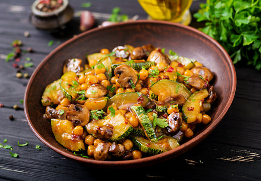 Vegan stir fry of mushrooms, zucchini and chickpea