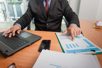 Businessman at working with financial reports