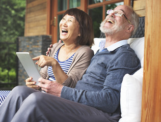 Senior couple using tablet 