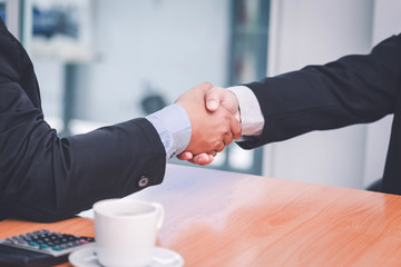 Business shaking hands. Business executives to congratulate the joint.