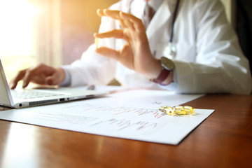 doctor working on a computer at his cabinet
