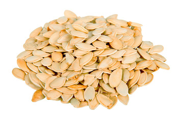 Pile of pumpkin seeds isolated on white.