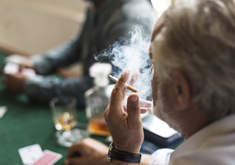 Adults socialising and playing cards