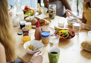 A group of diverse women having breakfast together