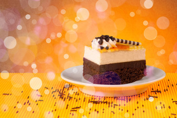 Delicious tasty homemade cakes with bokeh light background