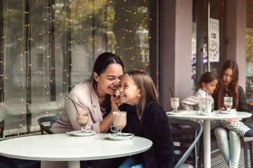 Family having fun in outdoor cafe