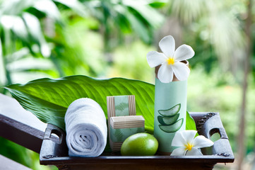 Natural cosmetics on a beautiful tropical background. Mineral, tropical cosmetics. Avocado, scarlet, lotus. Healthy lifestyle