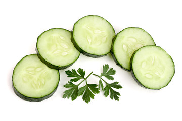 slices of cucumber with leaf parsley isolated on white background