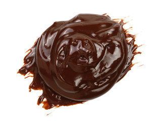 Hot melted chocolate pouring isolated on white background, top view