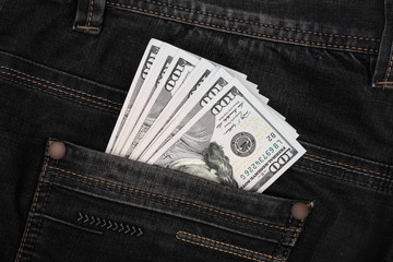 american dollar bills in jeans pocket background