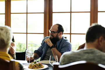Group of diverse friends are having a dinner together