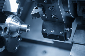 CNC lathe machine (Turning machine) cutting the metal  cone shape part .Hi-precision CNC machining concept.