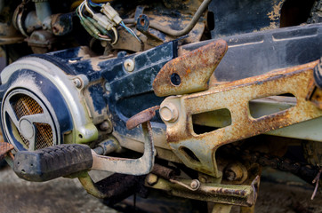 Old motorcycle parked on the wayside, Parts of classic motorcycles that have rust