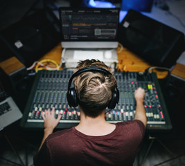 Man at sound mixer station