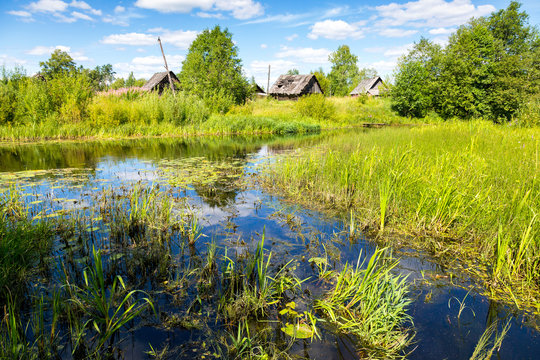 Beautiful summer landscape with small tranquil river in northern Russia in sunny summer day