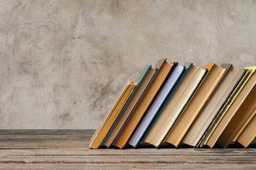 School blackboard with pile of books