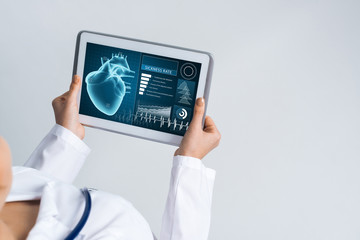Close of female doctor hands working with tablet pc computer