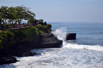 The temple by the sea, surrounded by waves crushing the rocks. Pic was taken in Tanah Lot, Bali