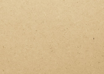 Beige particle pressed wood panel of oriented strand board (OSB) texture background in light brown...