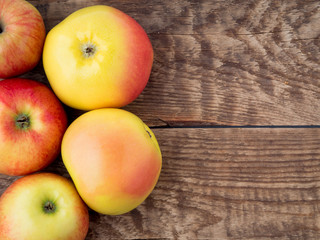 set of apples on wooden rustic table antique. The view from top, empty space for text.