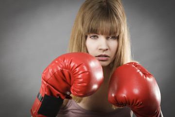 Woman wearing boxing gloves