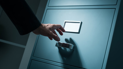 Office worker searching confidential information