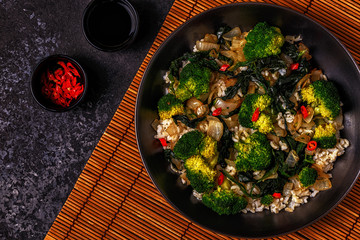 Cooking asian stir fry rice with vegetables