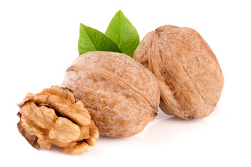 Walnuts with leaf isolated on white background