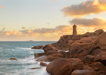 The beautiful lighthouse Phare Mean Ruz on the cote granite rose coast in Ploumanch, Brittany