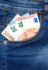 Euro in front pocket of jeans.