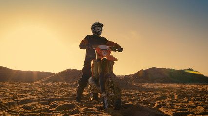 Shot of the Professional Motocross Driver Sitting on His FMX Dirt Bike.