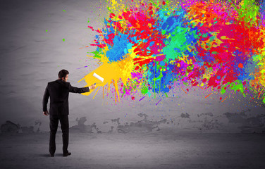 Sales person painting colorful splatter