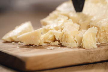 traditional grana padano italian cheese on olive board