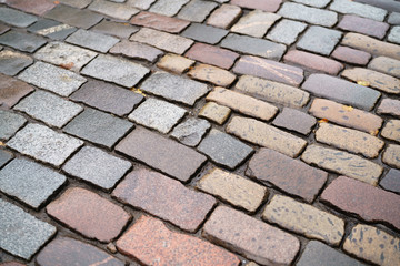 wet old granite pavement closeup