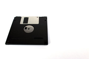 Black floppy disk isolated on white background (back side) perspective view