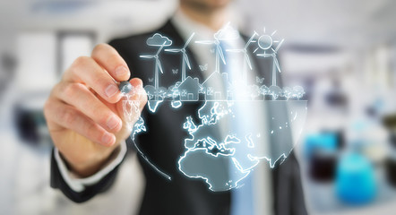 Businessman drawing renewable energy sketch