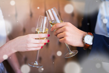 new year celebration - close up of champagne glasses in male and female hands