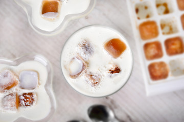  Milk cocktail with ice cubes with a form with a cubes top view