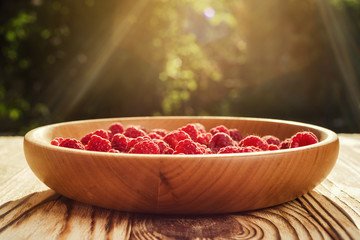 raspberries in a plate,in wooden bowl,basket/bush branch/growing raspberries,raspberries background closeup photo,high resolution product,Delicious first class organic fruit,Raspberry as background