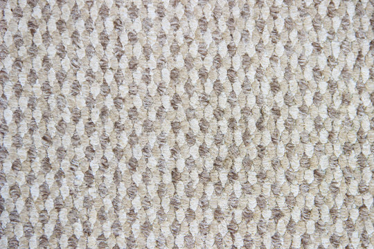 Light brown background with a wicker pattern, closeup