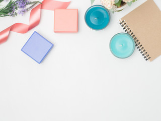 Flat lay, top view office table desk frame. feminine desk workspace with laptop, watch on white background.Love concept top view composition.note for somthing in love emotin.