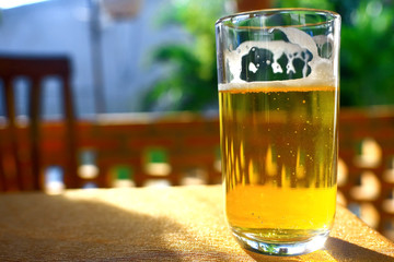A glass of beer on a table