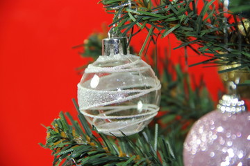christmas balls on white golden tree with red backgrounds white
