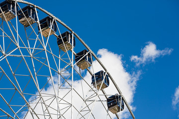 Ferris wheel on blue sky background