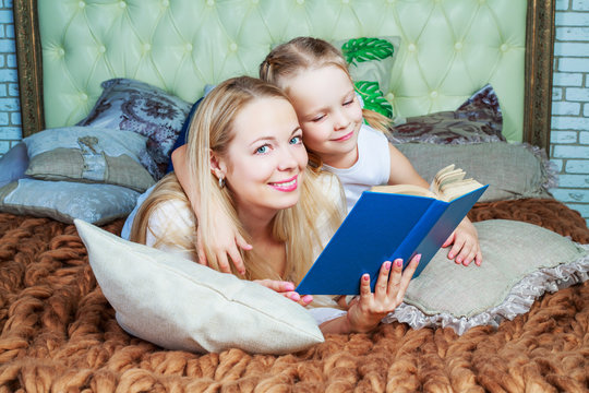 mother and daughter reading