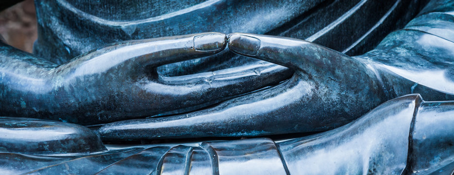 Detail of Buddha statue with Dhyana hand position, the gesture of meditation